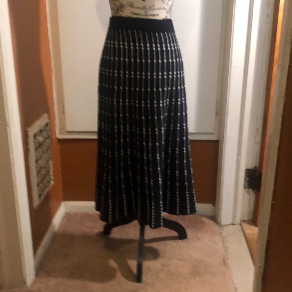 Calf length sweater skirt. That flares at bottom